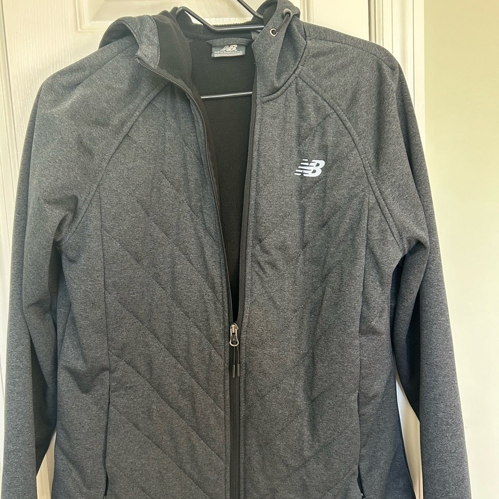 Women’s size med, dark gray, New Balance jacket. Pre-owned, very good condition.